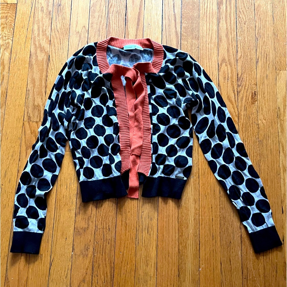 Numph black and white polka dot cardigan with an orange neck tie.